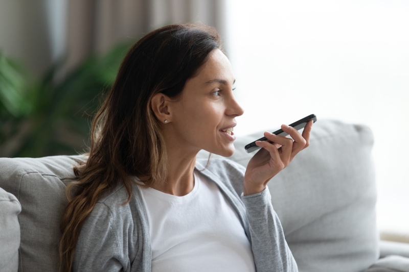 A woman using speech recognition in a hotline